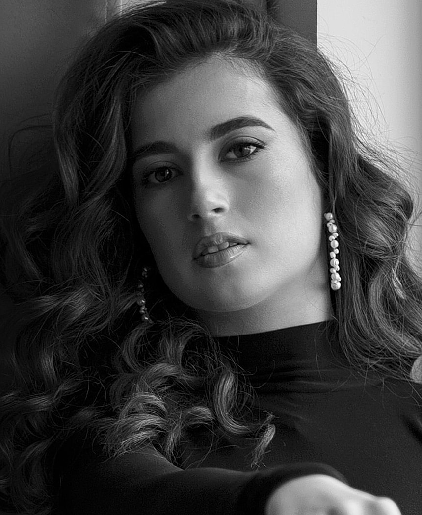 Model wearing a stylish beige fishnet bikini.