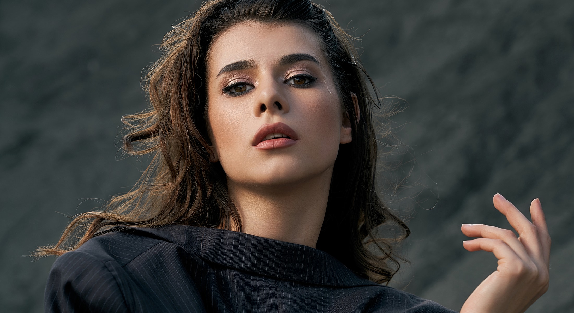 Portrait of a young woman with flowing hair.