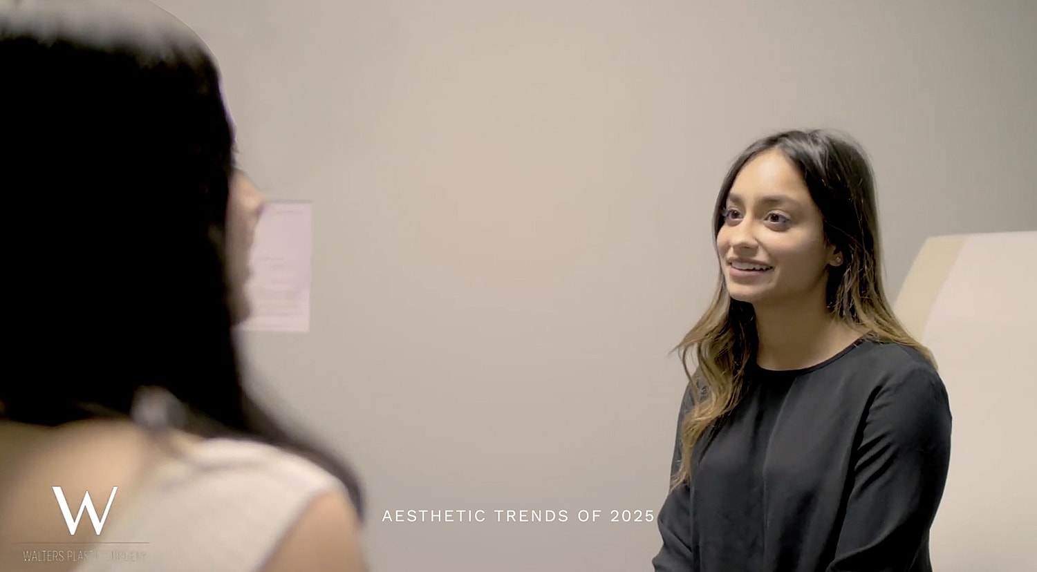 Man in suit discussing practice overview.